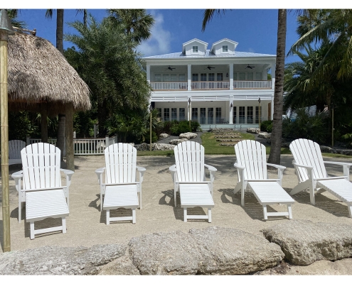 Adirondack chairs on the beach